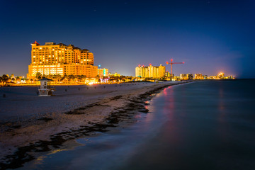 View of beachfront hotels and the beach from the fishing pier at - obrazy, fototapety, plakaty