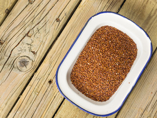 red quinoa in an enamel dish