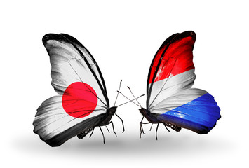 Two butterflies with flags Japan and Luxembourg