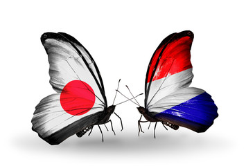 Two butterflies with flags Japan and Holland
