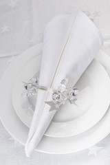 Christmas Napkin holder on white table set.