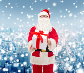 man in costume of santa claus with gift box