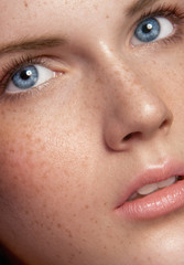 Close up beauty portrait of young girl with a lot of freckles - 74868899