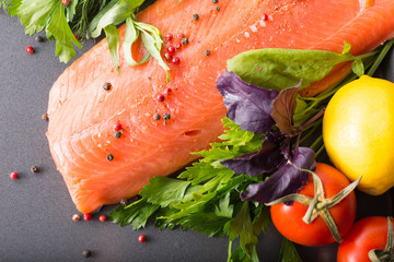 Salmon with seasoning on a pan