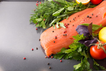 Salmon with seasoning on a pan