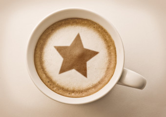 christmas star drawing on latte coffee cup
