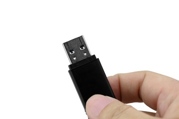 Hand holding USB flash drive