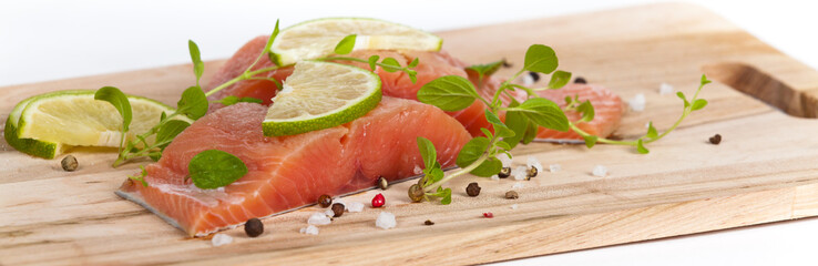Fresh salmon fillet with oregano and lime slices