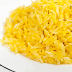 Yellow rice with cumin seeds. Selective focus.