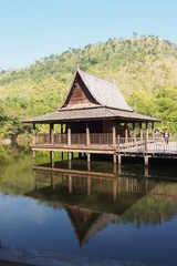 Fototapeta na wymiar Traditional timber temple on the water