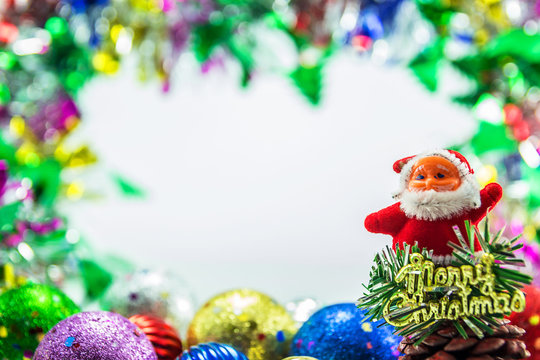 Santa claus dall and Christmas ornaments background