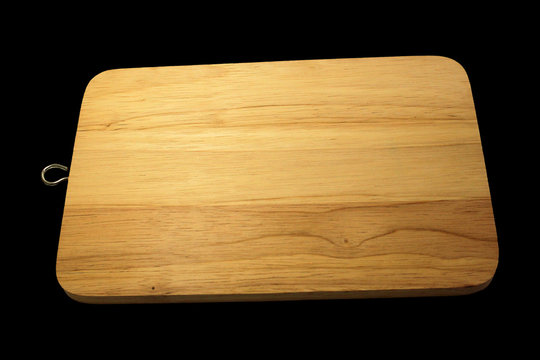wood cutting board isolated on black background