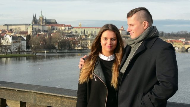 happy couple smile to camera - city (Prague)