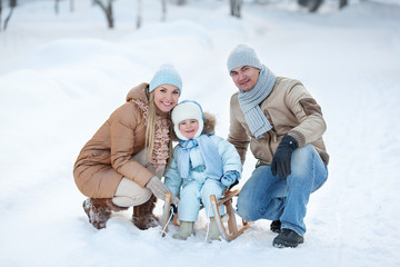 Portrait of Young family in a winter park