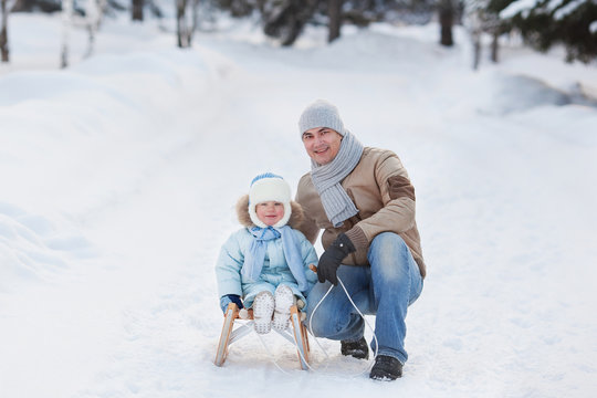 Portrait of Father with Her Child in Winter Park