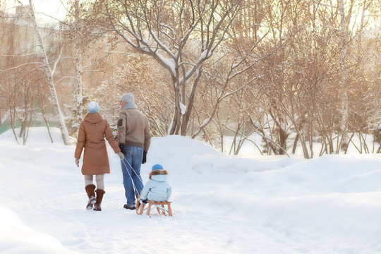 Young parents walking in Winter