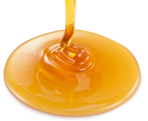 Honey flowing on white background. Clipping paths. © volff