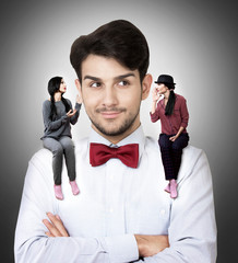 Man with two talking women sitting on his shoulders