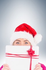 Festive blonde holding christmas gift