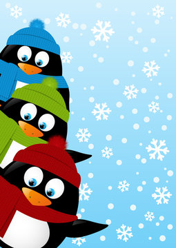 Cute penguins on winter background