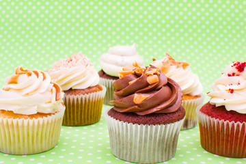 Some cupcakes on green background