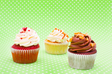 Some cupcakes on green background