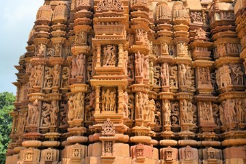 Fototapeta na wymiar Erotic Kamasutra carvings of Hindu temple in India