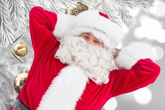 Composite image of happy santa lying and relaxing