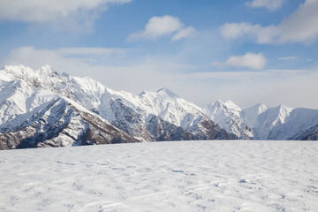 Fototapeta premium snowy mountains with clouds