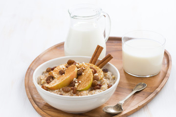 healthy breakfast - oatmeal with apples, raisins, cinnamon