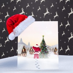 Composite image of santa delivery presents to village