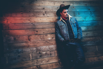 Winter cowboy jeans fashion man. Wearing brown hat, jeans jacket