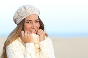 Woman smile with a perfect white teeth in winter