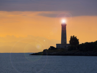 Fototapeta premium Lighthouse at sunset in Gytheio, Greece