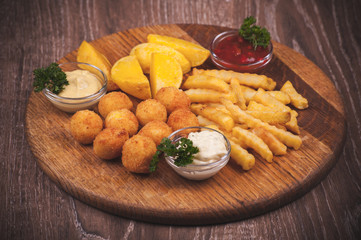 fried potato platter with dips