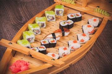 sushi roll set on boat plate