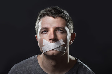 young man mouth sealed on tape censored freedom speech concept - obrazy, fototapety, plakaty