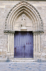 Fototapeta na wymiar Portal in romanesque church in Reims, France.