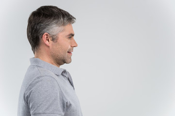 Profile view of smiling confident business man.