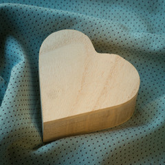 heart  wooden box on cloth fabric background