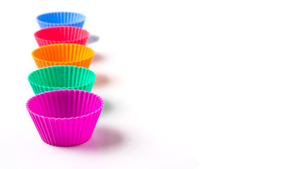 Cupcake silicone baking cups over white background 