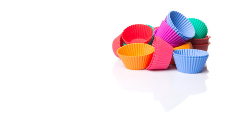 Cupcake silicone baking cups over white background 