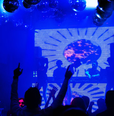 Silhouettes people dancing at nightclub
