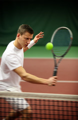 .Young man playing tennis
