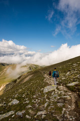 Fototapeta na wymiar Hiker at Fagaras Mountains, Southern Carpathians, Romania