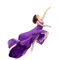 Fototapeta premium jumping girl dancer in flying purple dress
