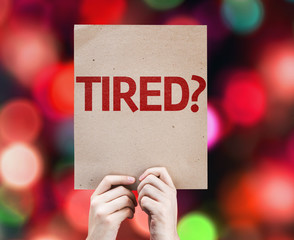 Tired? card with colorful background with defocused lights
