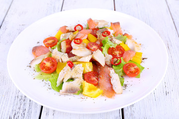 Fresh fish salad with vegetables