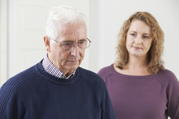 Serious Senior Man With Adult Daughter At Home