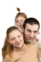 Fototapeta premium Mom dad and daughter one behind the other
